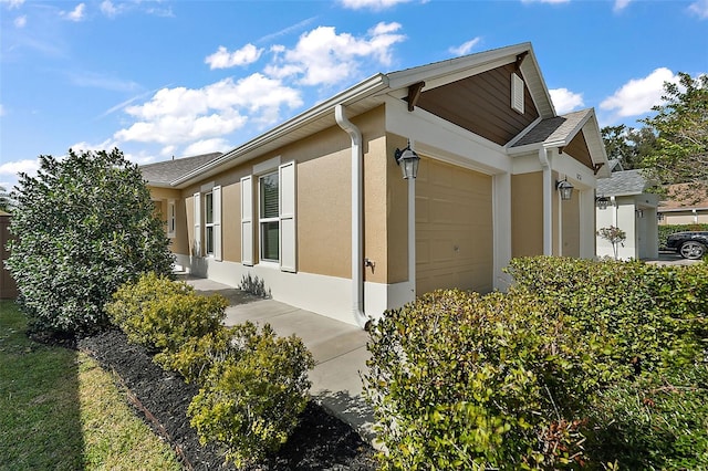 view of property exterior with a garage