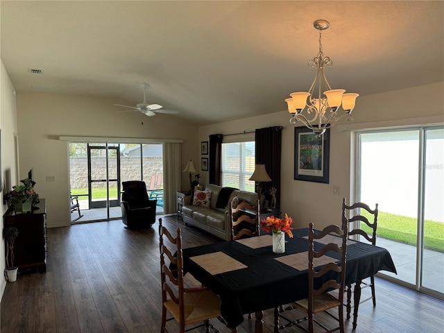 dining room featuring lofted ceiling, ceiling fan with notable chandelier, and wood-type flooring