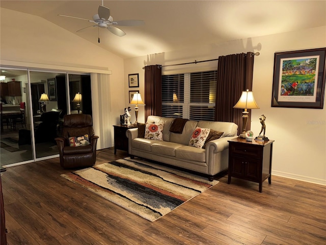 living room featuring ceiling fan, wood-type flooring, and vaulted ceiling