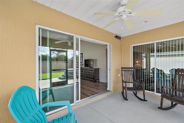 exterior space with ceiling fan