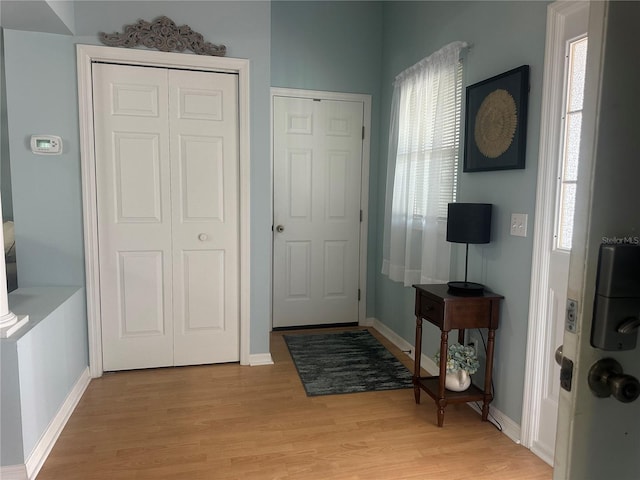 foyer entrance with light hardwood / wood-style flooring