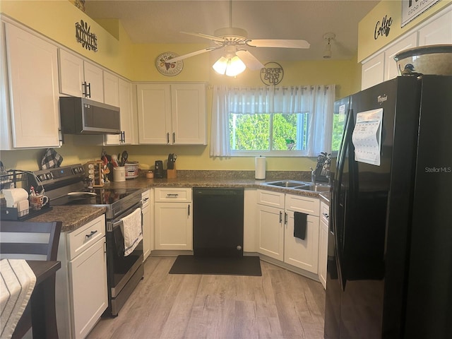 kitchen featuring white cabinetry, sink, black appliances, ceiling fan, and light wood-type flooring