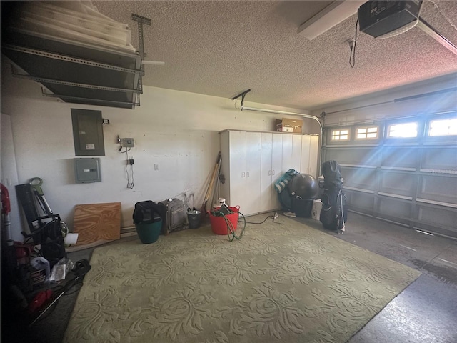 garage featuring electric panel and a garage door opener