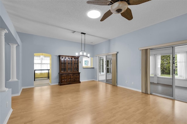 956 Chula Ct, The Villages, FL 32159 - interior space featuring a textured ceiling, wood finished floors, ceiling fan, and plenty of natural light