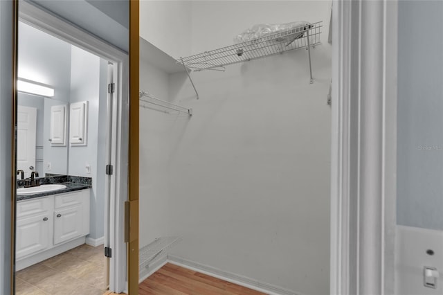 956 Chula Ct, The Villages, FL 32159 - walk in closet with a sink