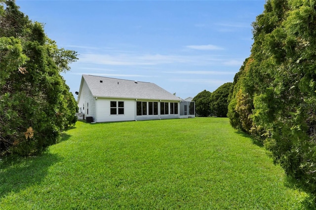 956 Chula Ct, The Villages, FL 32159 - back of house with a yard and a sunroom