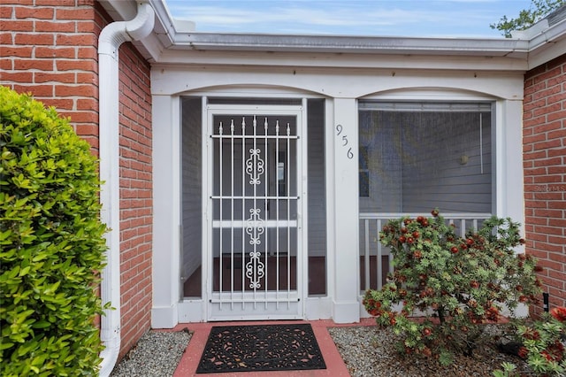 956 Chula Ct, The Villages, FL 32159 - property entrance featuring brick siding