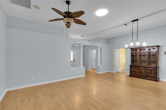 956 Chula Ct, The Villages, FL 32159 - unfurnished room featuring light wood-style flooring, visible vents, ceiling fan, and a textured ceiling