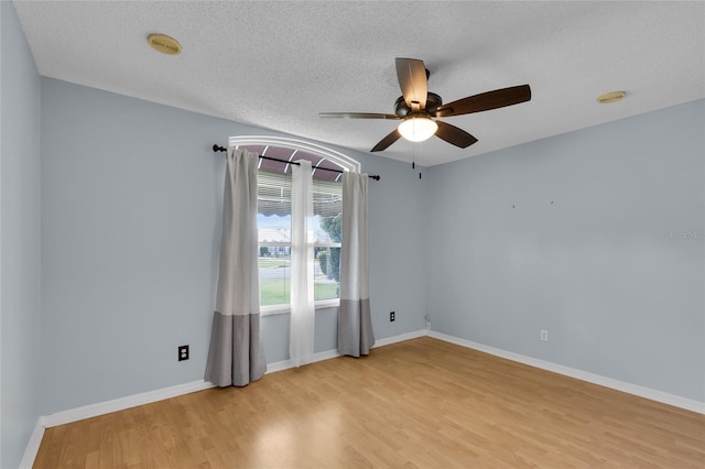 956 Chula Ct, The Villages, FL 32159 - empty room featuring ceiling fan, a textured ceiling, light wood-style floors, and baseboards