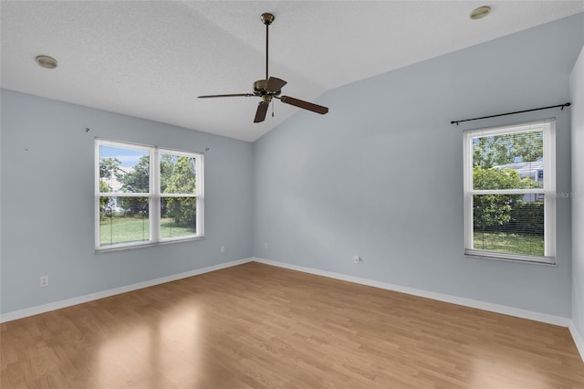 956 Chula Ct, The Villages, FL 32159 - unfurnished room featuring light wood-style flooring, ceiling fan, baseboards, and lofted ceiling
