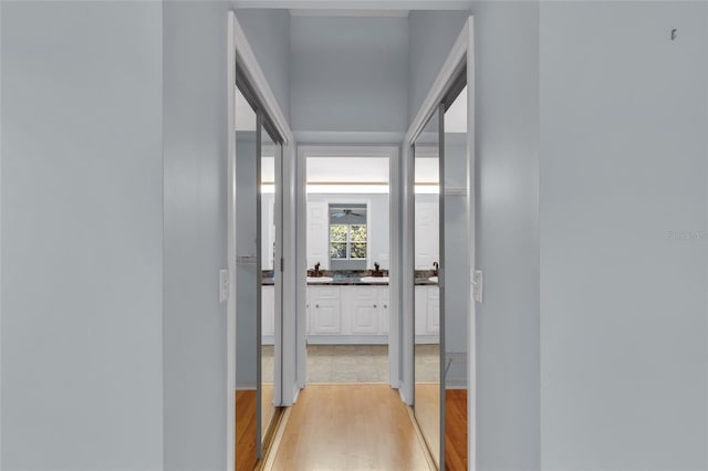 956 Chula Ct, The Villages, FL 32159 - corridor featuring light wood-type flooring