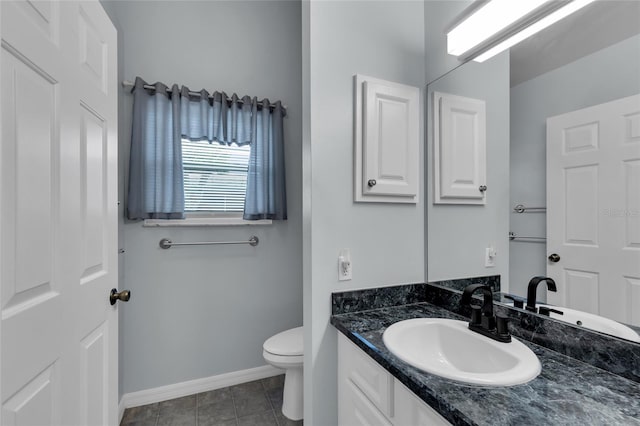 956 Chula Ct, The Villages, FL 32159 - bathroom with tile patterned floors, toilet, vanity, and baseboards
