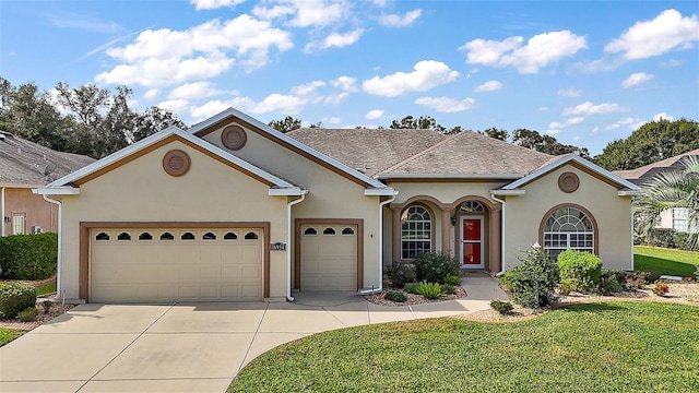 view of front facade with a garage and a front yard