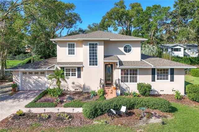 view of front of home with a garage