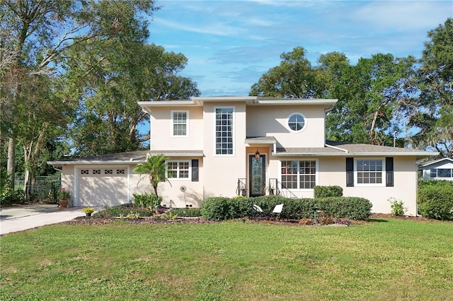 view of front of property with a garage and a front lawn