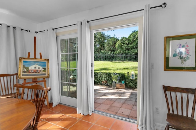 doorway with light tile patterned flooring