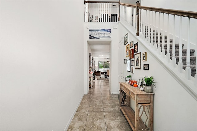 corridor featuring light tile patterned floors