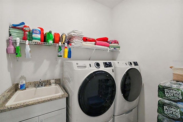 laundry area with washer and dryer and sink