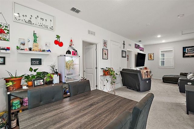 dining area featuring carpet