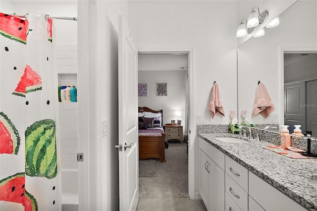 bathroom with shower / bath combo and vanity