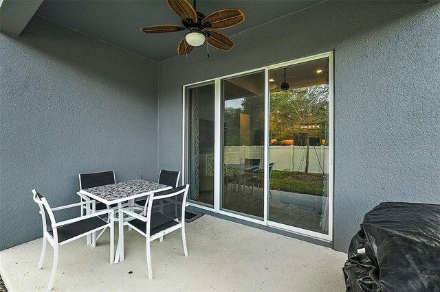 view of patio featuring ceiling fan