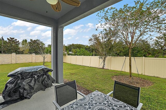 view of yard featuring ceiling fan and a patio area