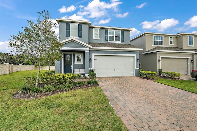 view of front of home featuring a garage and a front yard