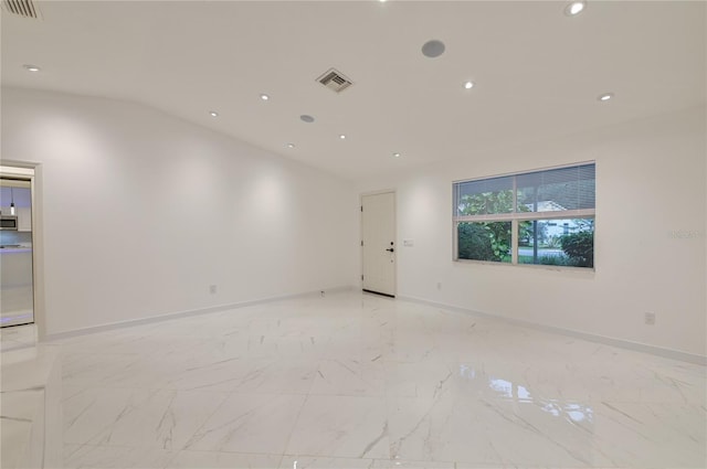 empty room with vaulted ceiling