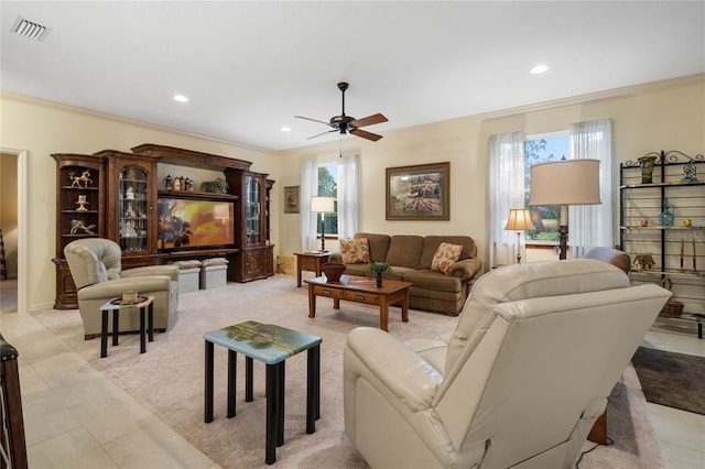 tiled living room featuring ornamental molding and ceiling fan