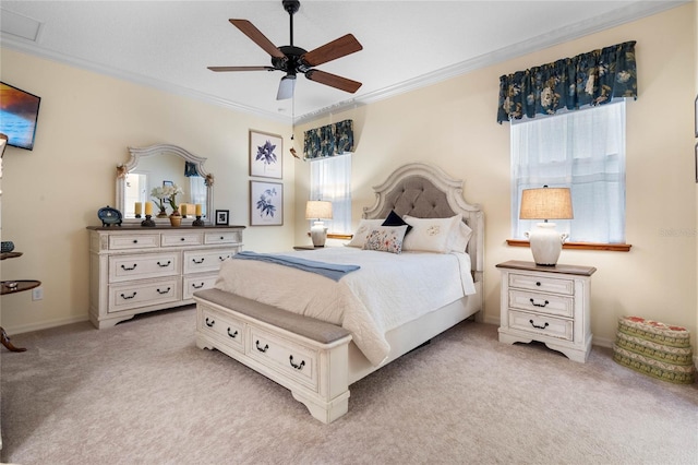 bedroom with ornamental molding, light carpet, and ceiling fan