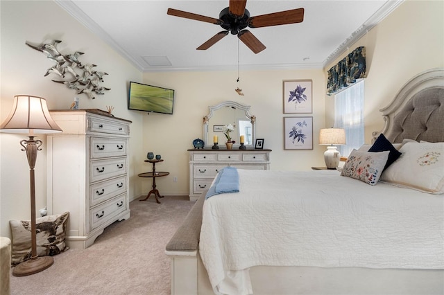 carpeted bedroom featuring ornamental molding and ceiling fan