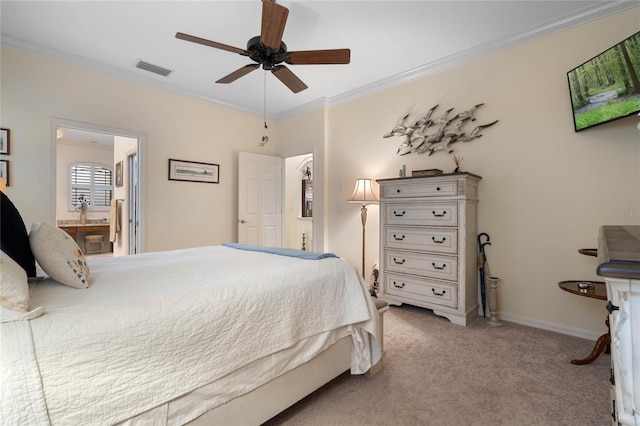 carpeted bedroom featuring ceiling fan, connected bathroom, and ornamental molding