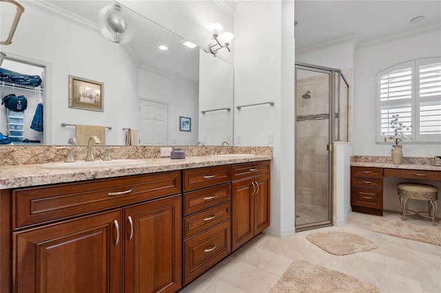 bathroom with an enclosed shower, vanity, and crown molding