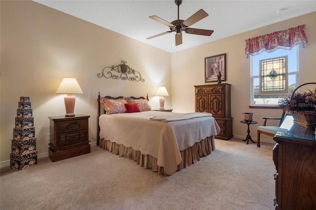 bedroom featuring light carpet and ceiling fan