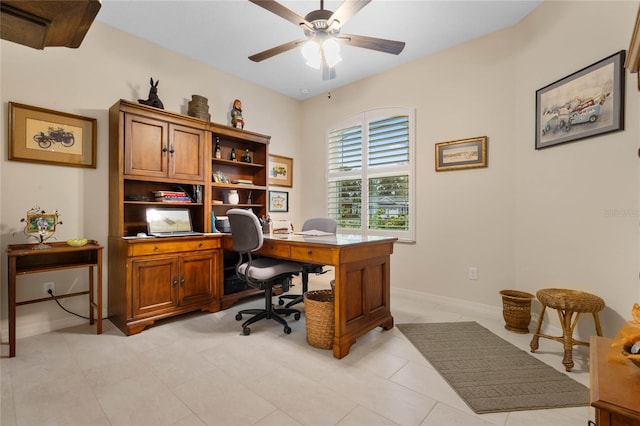 tiled office space featuring ceiling fan