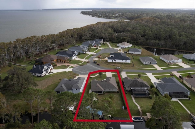 birds eye view of property with a water view