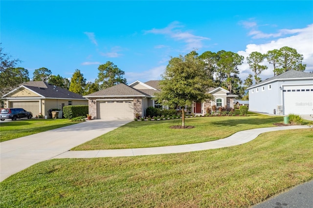 ranch-style home with a garage and a front lawn