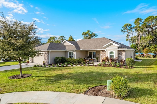 ranch-style home featuring a garage and a front yard