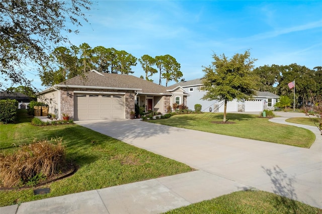 single story home with a garage and a front lawn