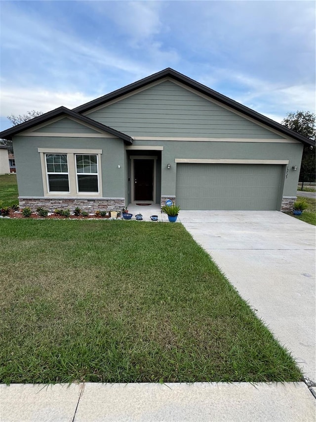 ranch-style house with a front lawn and a garage