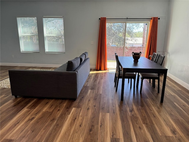 dining area with dark hardwood / wood-style floors