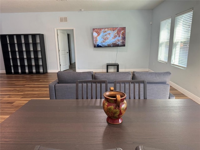 dining space featuring hardwood / wood-style flooring