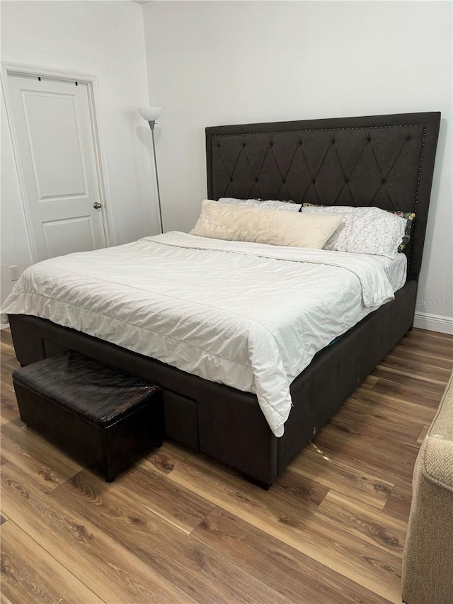 bedroom with wood-type flooring