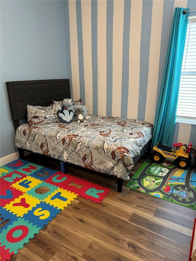 bedroom with hardwood / wood-style floors