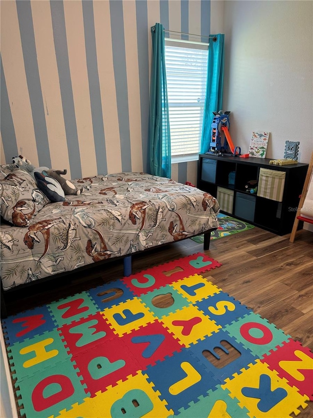 bedroom with hardwood / wood-style flooring