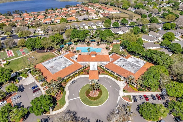 birds eye view of property with a water view