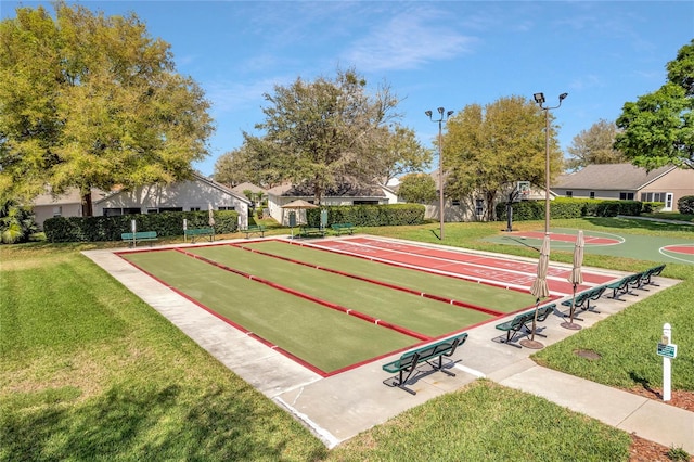 view of home's community with a yard