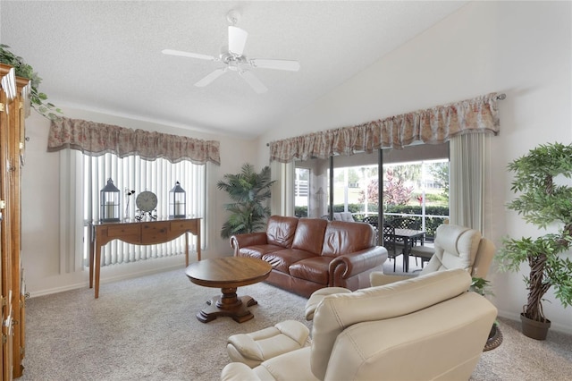 living room with light carpet, a textured ceiling, ceiling fan, and lofted ceiling