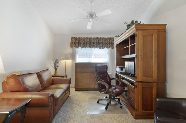 office with lofted ceiling, ceiling fan, and a textured ceiling