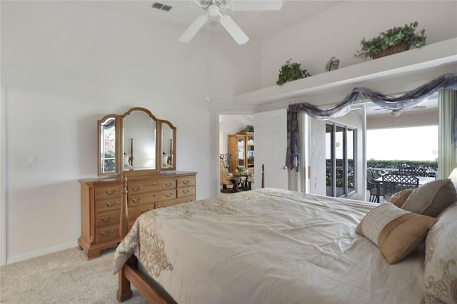 bedroom with carpet flooring, multiple windows, ceiling fan, and access to outside